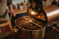 A premium lifestyle image of coffee beans roasting inside a small batch drum roaster. Warm tones, soft natural light, artisan craftsmanship aesthetic, minimal background, high-end coffee brand style.
